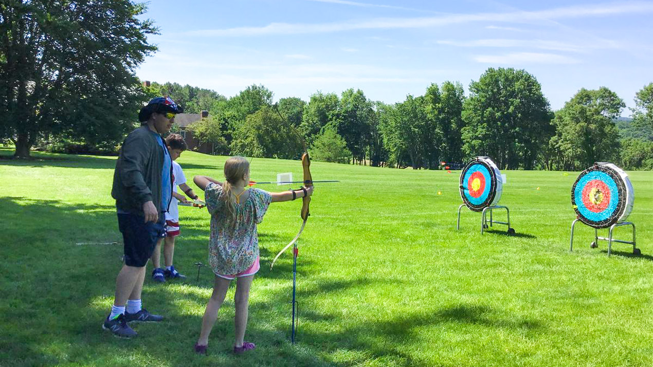 Campers on the archery field